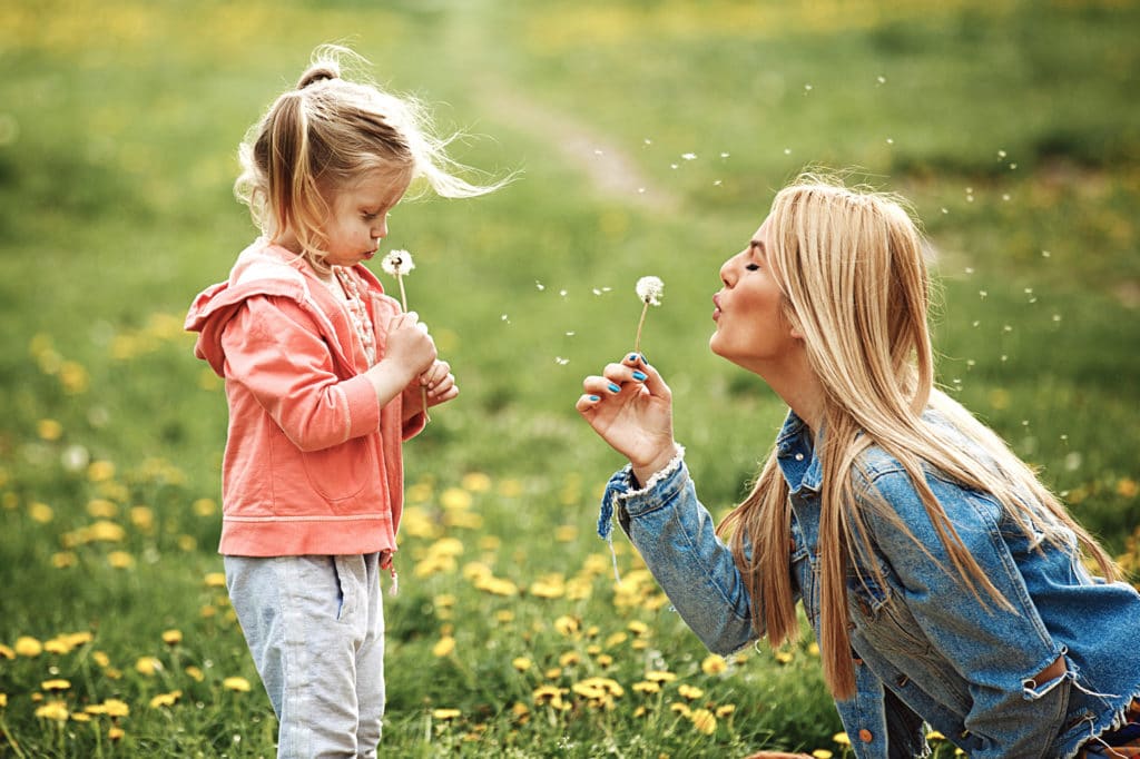 mom-and-daughter-with-dandelions